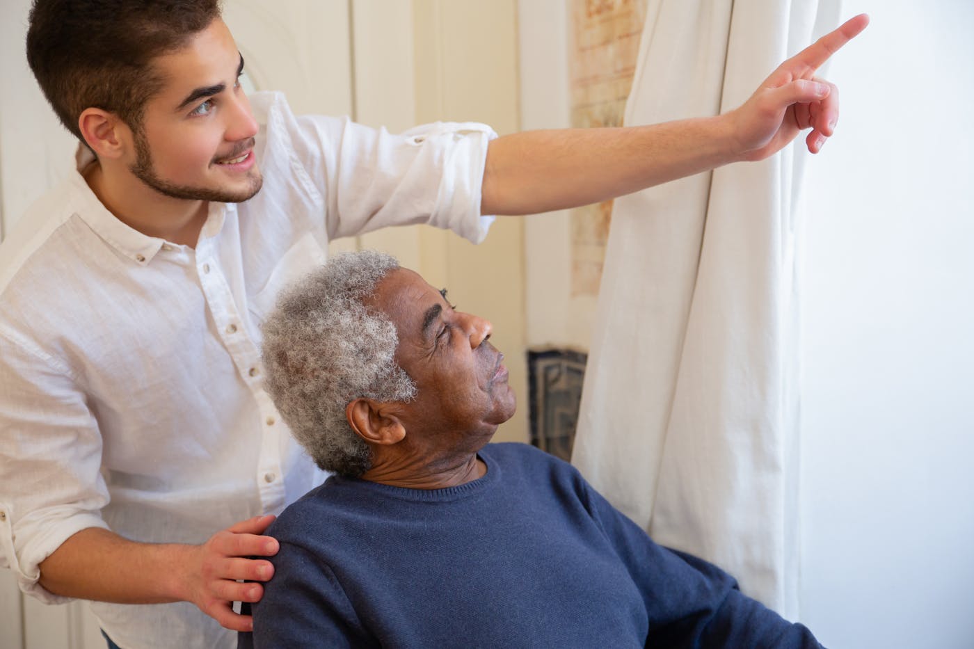 Compassionate caregiver assisting with daily activities in a comfortable home setting
